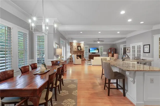 a kitchen with granite countertop a stove top oven and cabinets