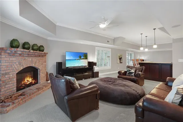 a front view of a house with swimming pool having outdoor seating