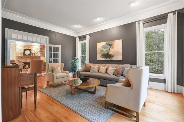 a living room with furniture and a fireplace