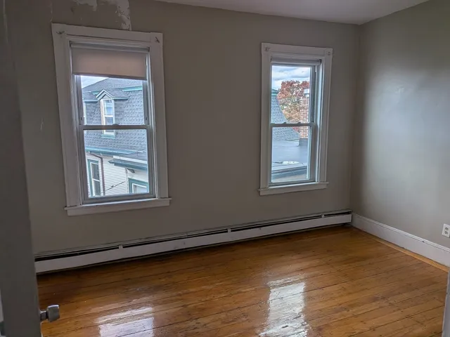 a view of a room that has a window in it