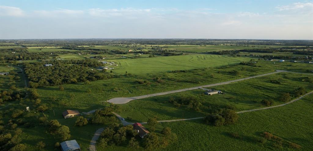 1033 Carnagie Road Poolville, TX 76487 - Photo 1 of 5 a view of a field with an ocean