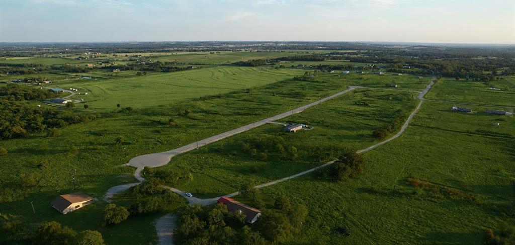 1033 Carnagie Road Poolville, TX 76487 - Photo 2 of 5 a view of a field with an ocean