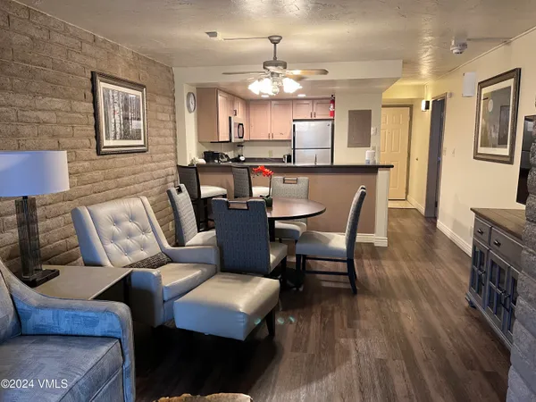a view of a dining room with furniture and wooden floor