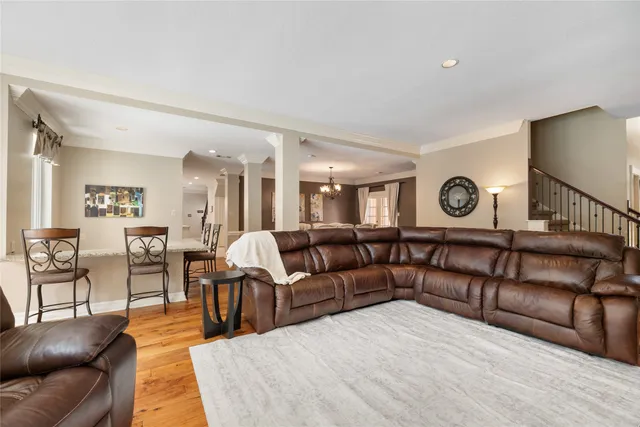 a living room with furniture and a clock