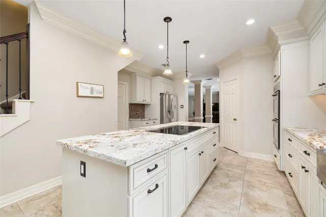 a large bathroom with a granite countertop sink a large mirror and shower