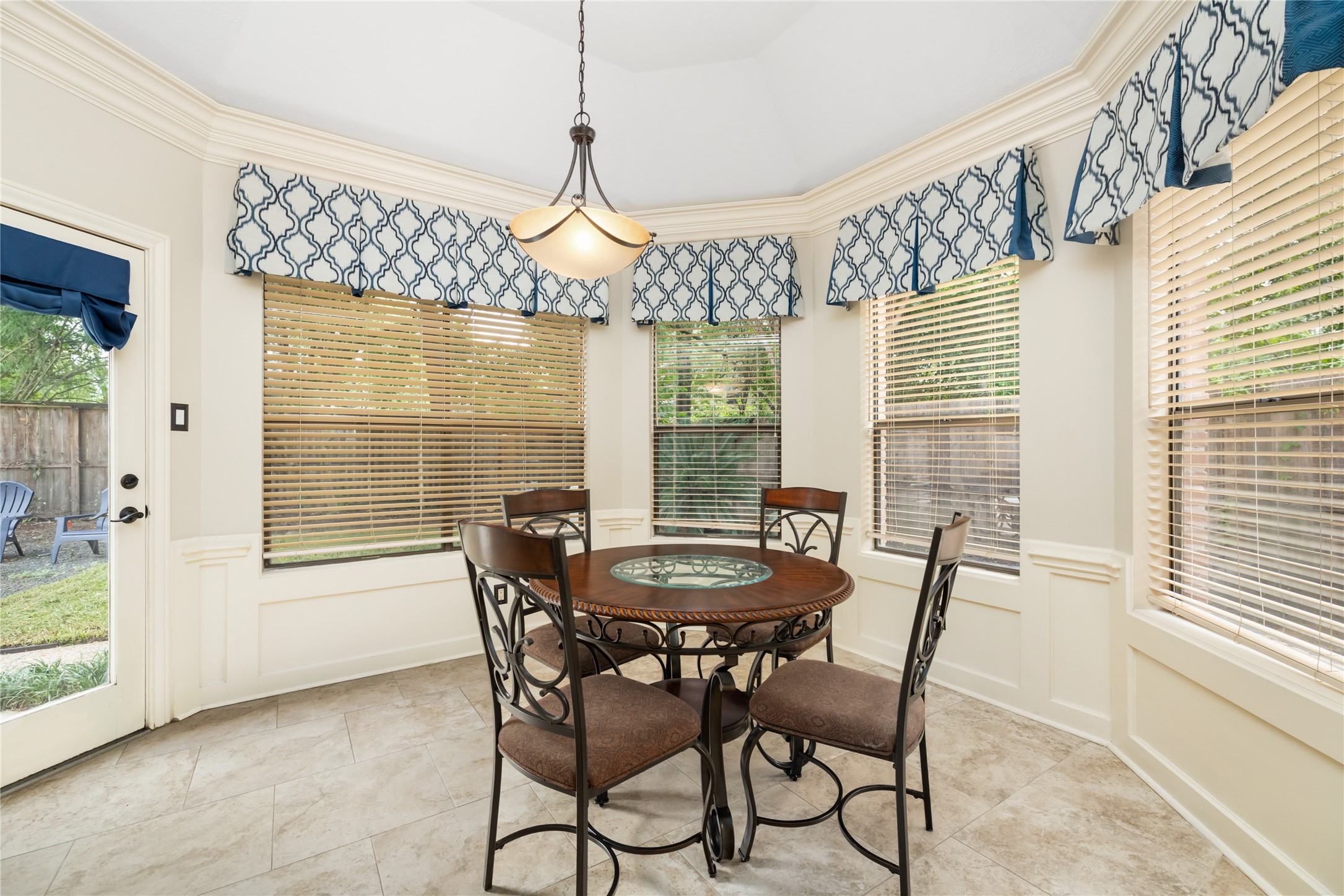 3106 Rustling Moss Drive Houston, TX 77068 - Photo 21 of 45 a dining room with furniture a chandelier and wooden floor