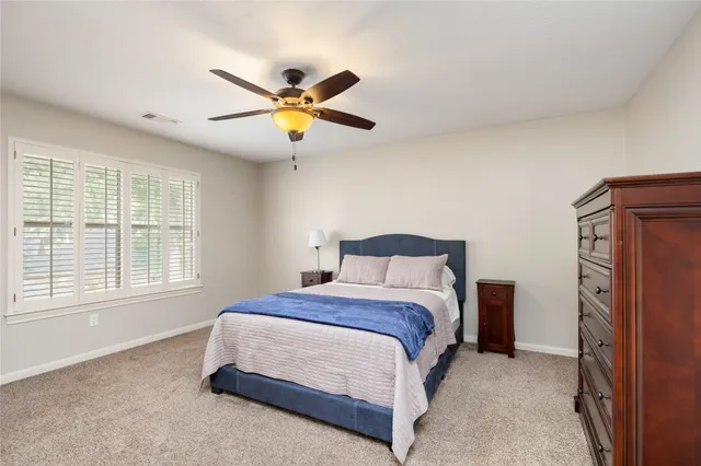 a en suite bathroom with a sink a mirror and a shower