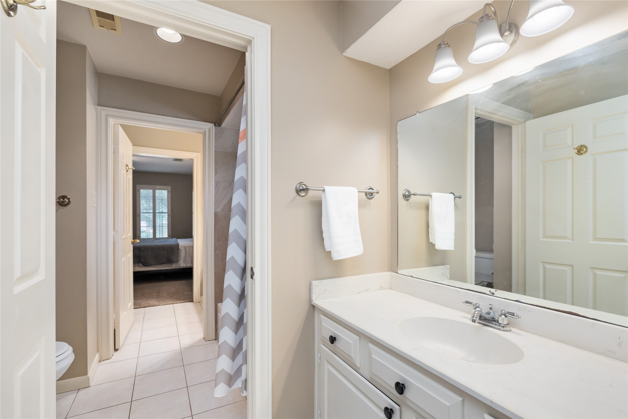 3106 Rustling Moss Drive Houston, TX 77068 - Photo 28 of 45 a en suite bathroom with a sink a mirror and a shower