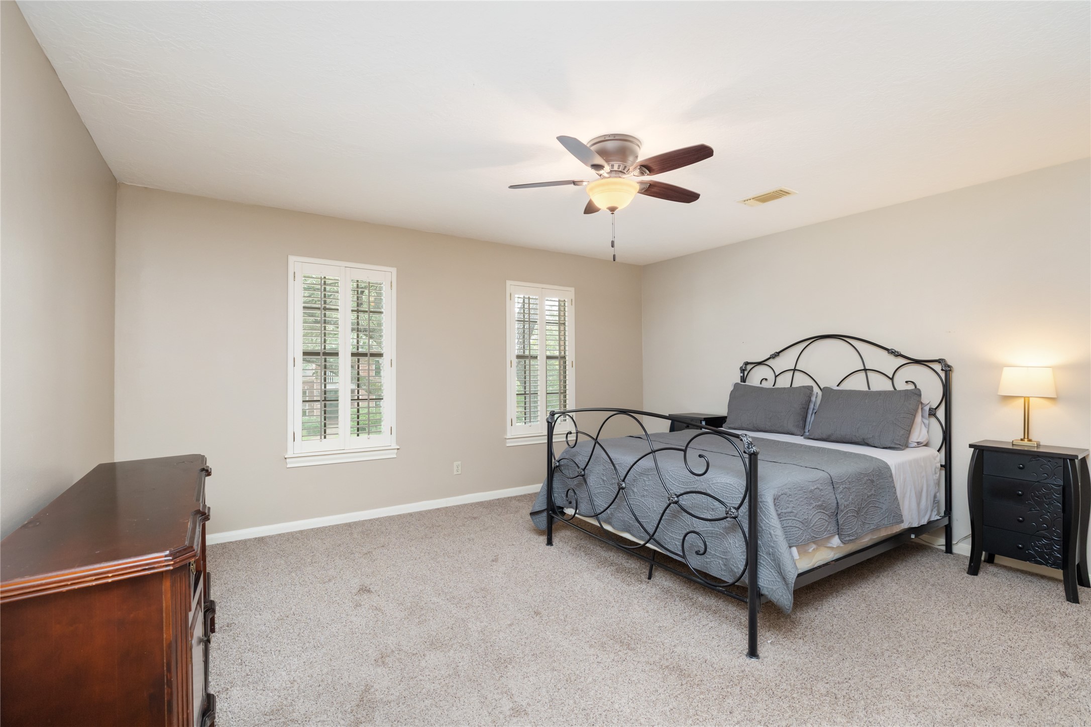 3106 Rustling Moss Drive Houston, TX 77068 - Photo 30 of 45 a bedroom with a bed and a window