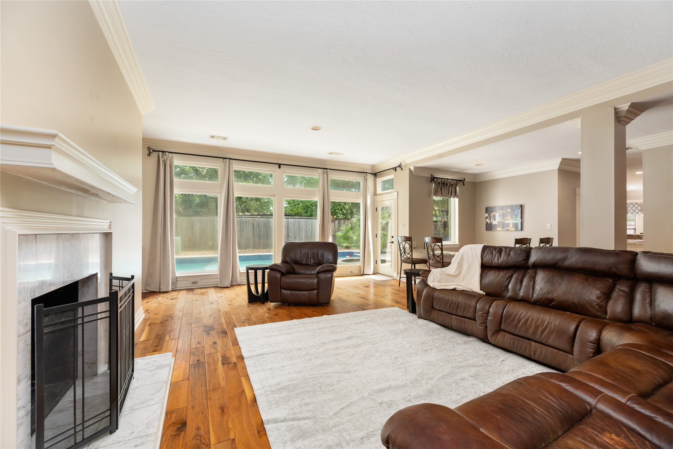 3106 Rustling Moss Drive Houston, TX 77068 - Photo 10 of 45 a living room with furniture and a fireplace