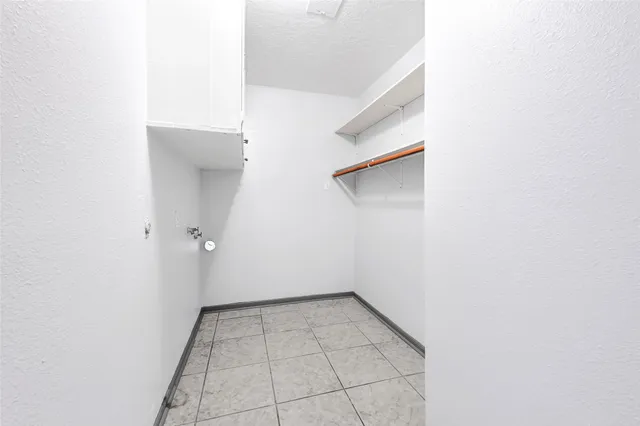 a view of a room with white walls