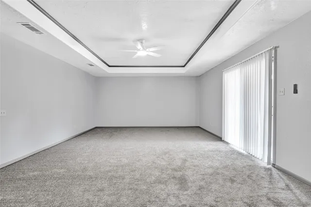 a bathroom with a bathtub and a toilet