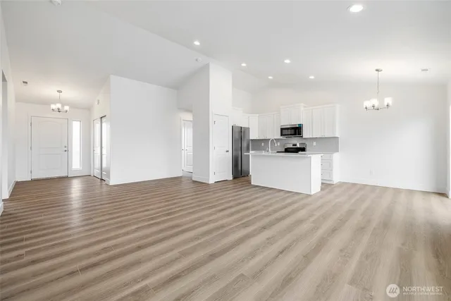 a view of a kitchen with a sink and an oven