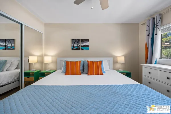 a bed room with a bed and a window