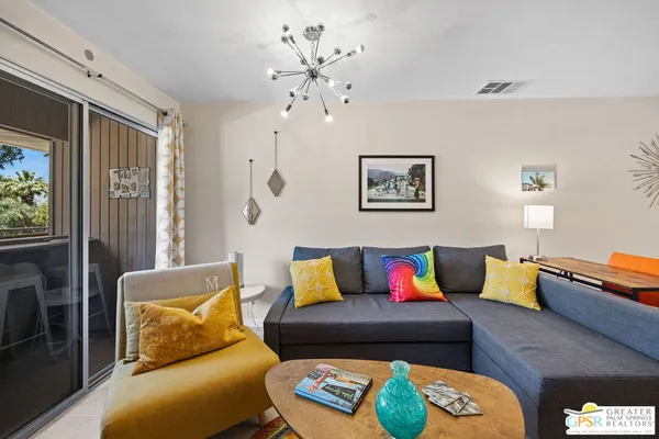 a living room with furniture and a couch