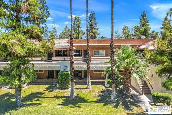 a swimming pool with outdoor seating and yard