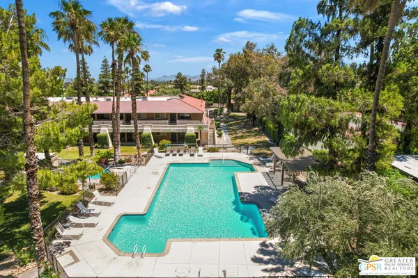 a view of a swimming pool with a patio