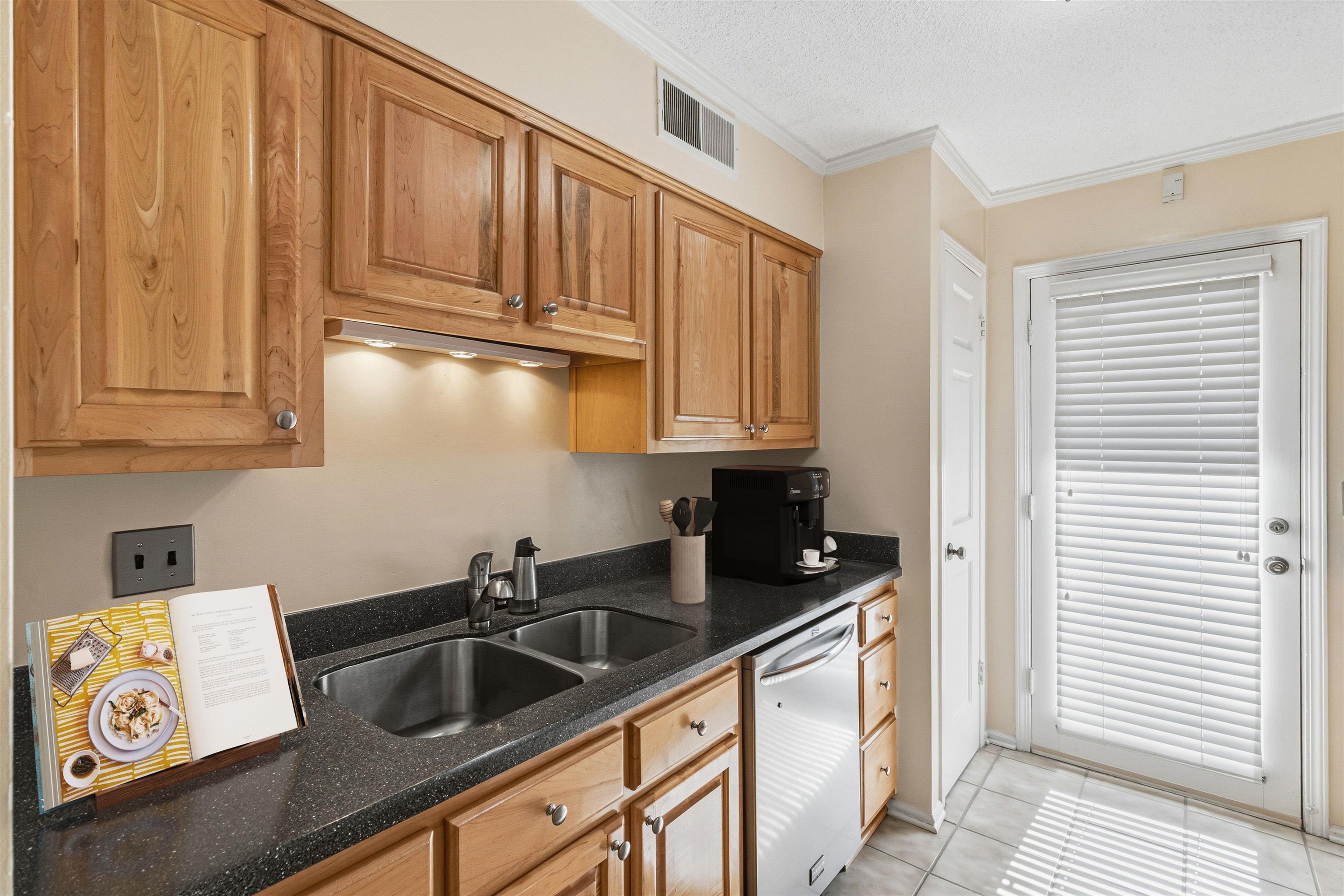 6905 Petworth Road, Unit 6905 Memphis, TN 38119 - Photo 16 of 32 a kitchen with stainless steel appliances granite countertop a sink stove and cabinets
