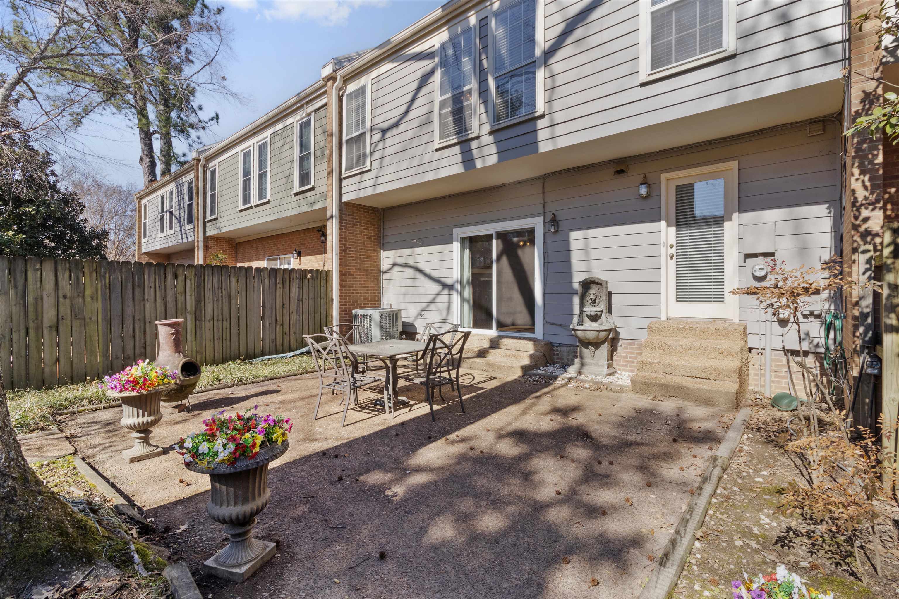 6905 Petworth Road, Unit 6905 Memphis, TN 38119 - Photo 2 of 32 a view of a tables and chairs in a patio