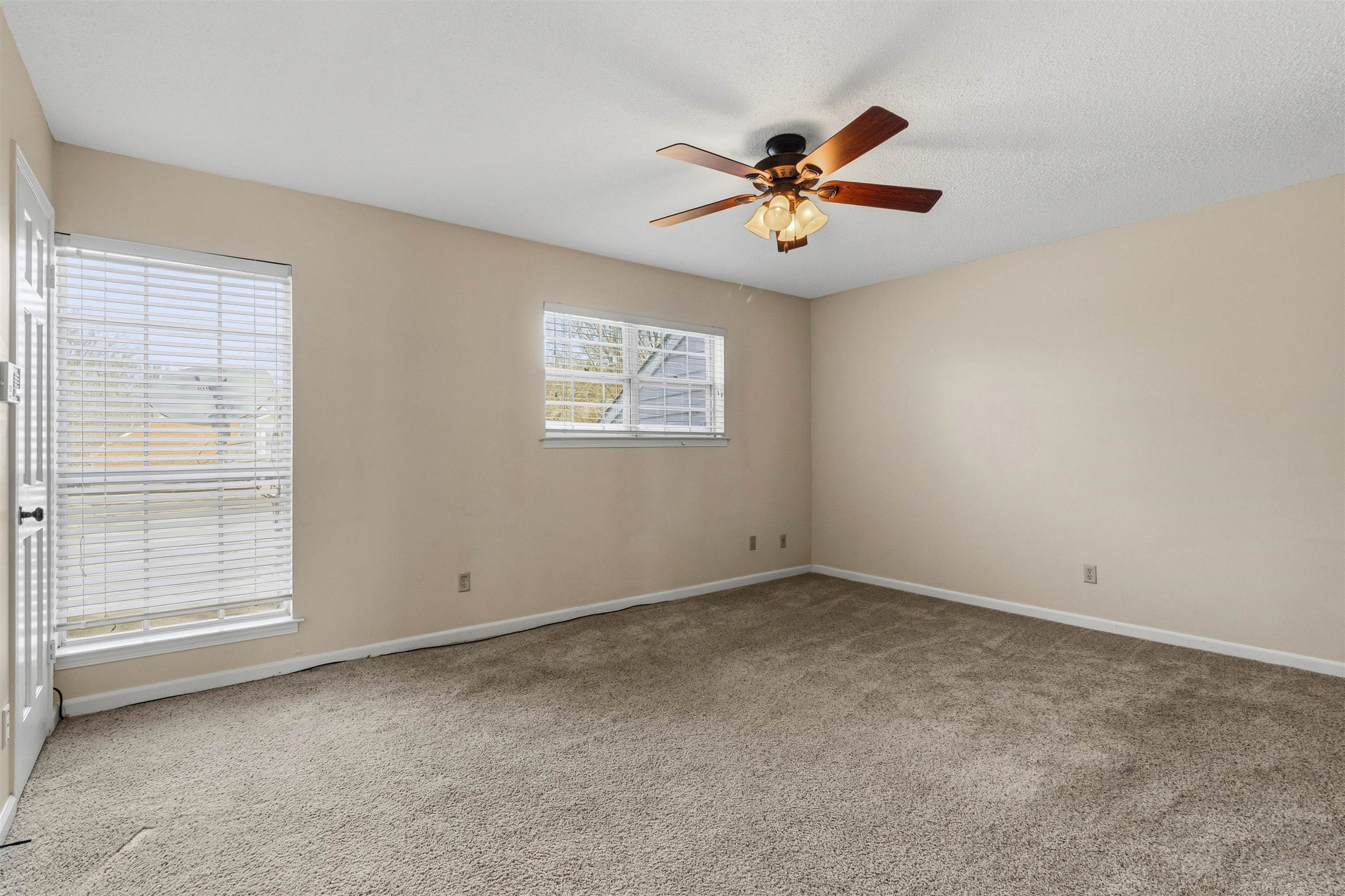 6905 Petworth Road, Unit 6905 Memphis, TN 38119 - Photo 27 of 32 an empty room with windows and fan