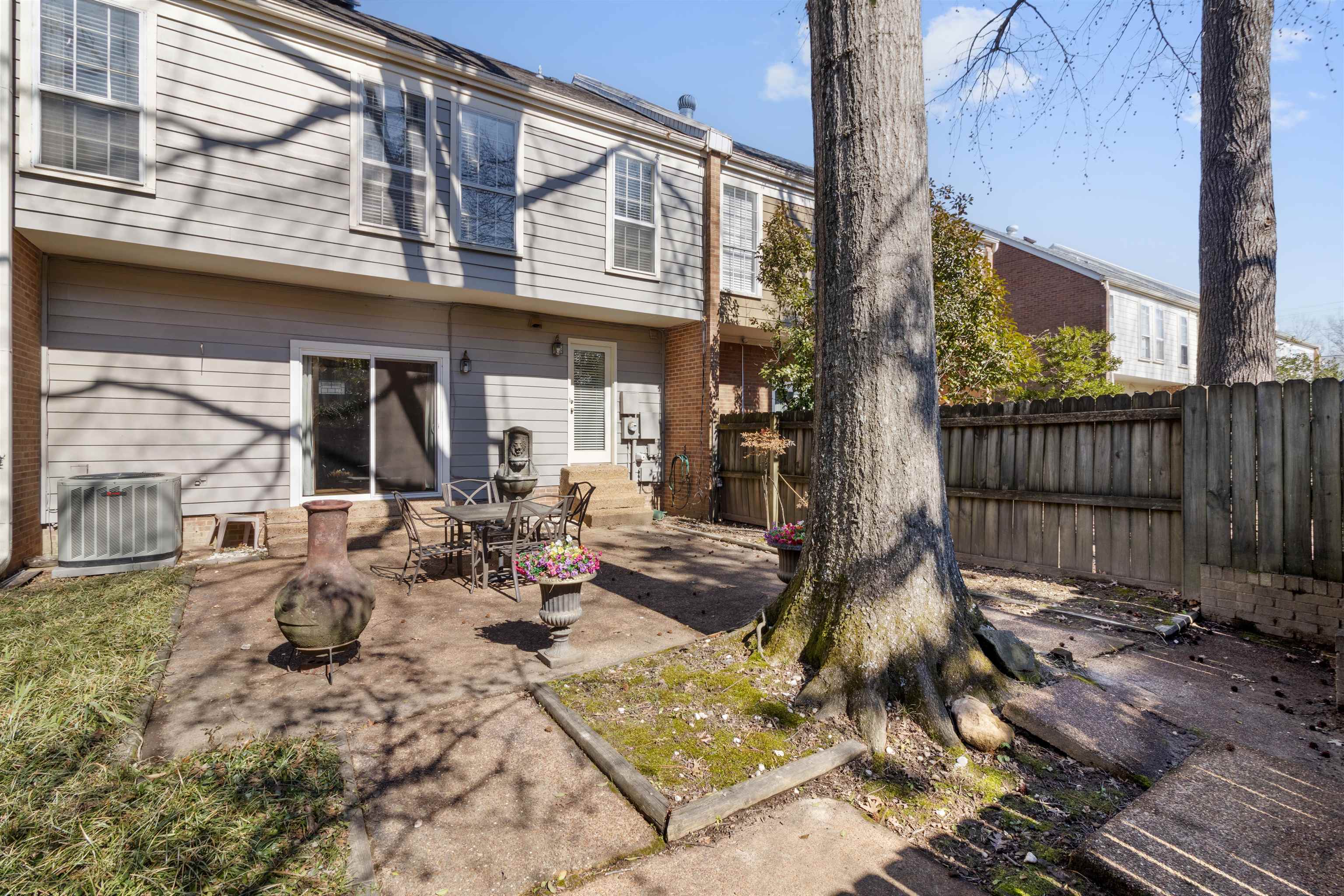 6905 Petworth Road, Unit 6905 Memphis, TN 38119 - Photo 30 of 32 a view of a dinning tables and chairs in patio