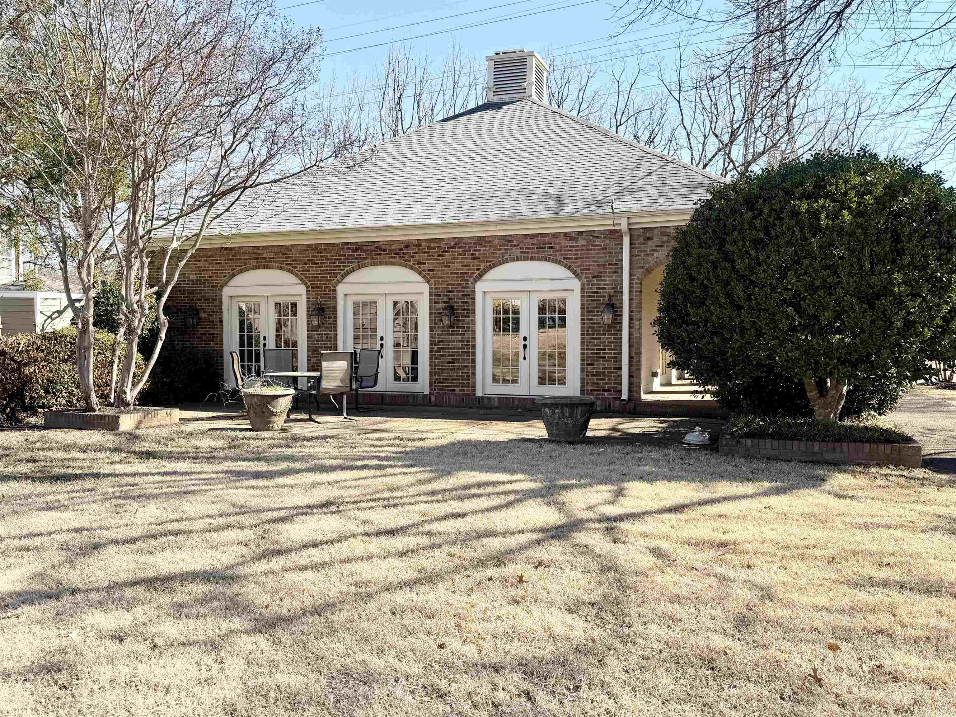 6905 Petworth Road, Unit 6905 Memphis, TN 38119 - Photo 4 of 32 a front view of a house with a yard