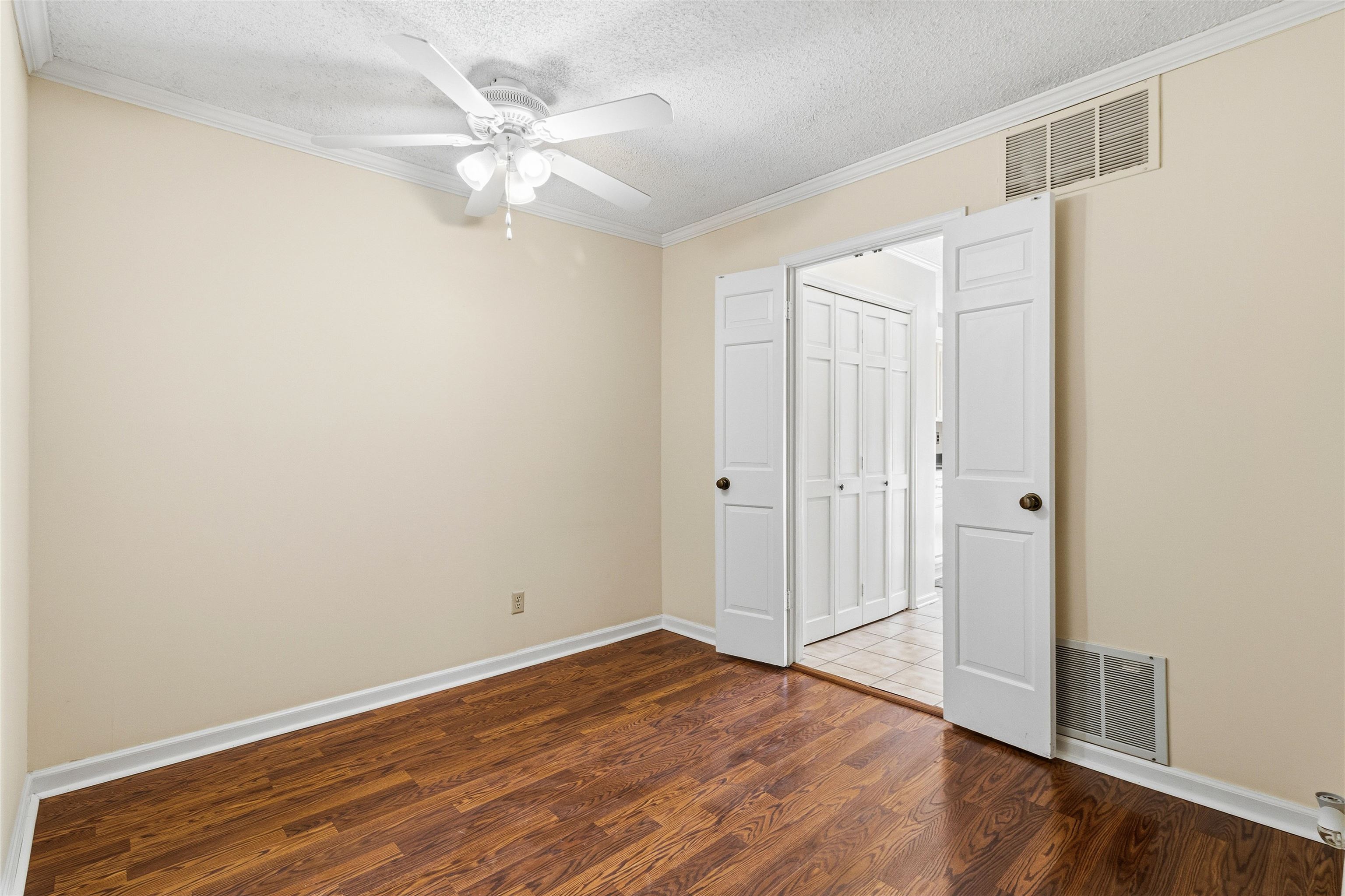 6905 Petworth Road, Unit 6905 Memphis, TN 38119 - Photo 10 of 32 a view of an empty room with wooden floor