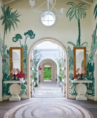 a view of hall way with furniture