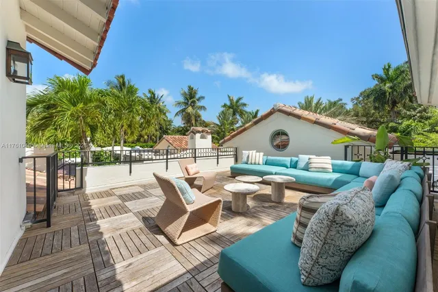 a view of house with swimming pool and a porch