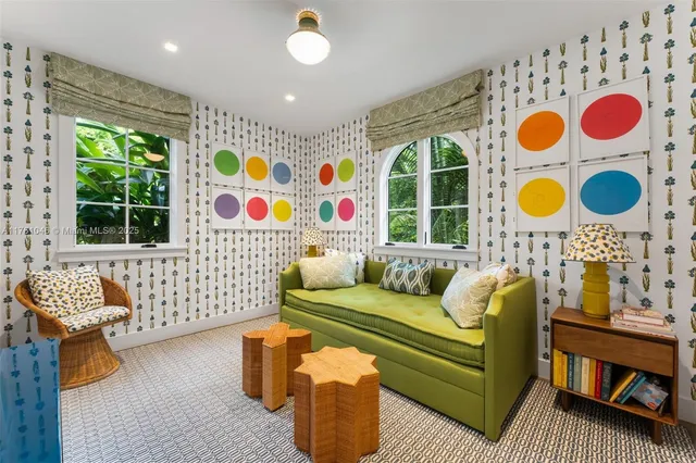 a bedroom with a bed and large window