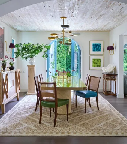 a dining room with furniture and window