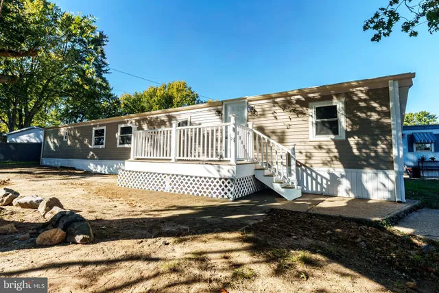 a view of a house with a snow in the yard