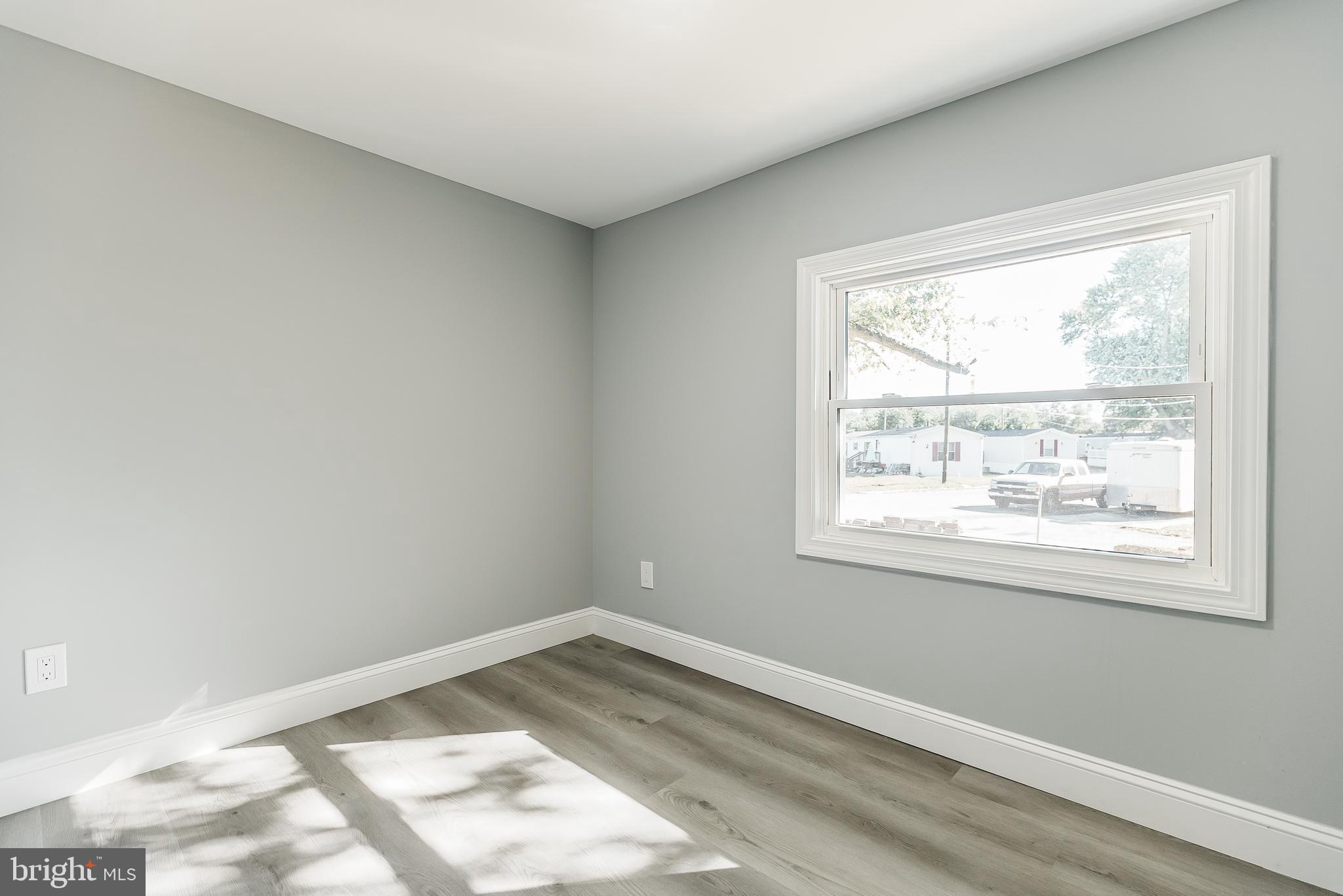 115 5th Street, Unit 31 Delaware City, DE 19706 - Photo 9 of 11 an empty room with a window