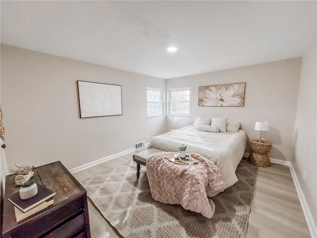 1529 Bower Hill Road Pittsburgh, PA 15243 - Photo 11 of 28 a bedroom with a bed and painting on the wall