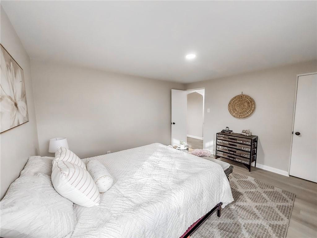 1529 Bower Hill Road Pittsburgh, PA 15243 - Photo 12 of 28 a bedroom with a bed and a chandelier