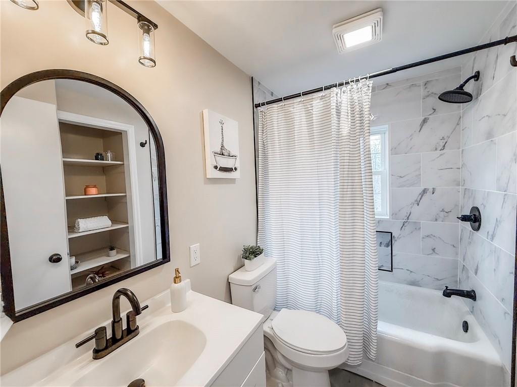 1529 Bower Hill Road Pittsburgh, PA 15243 - Photo 14 of 28 a bathroom with a sink a toilet and a mirror