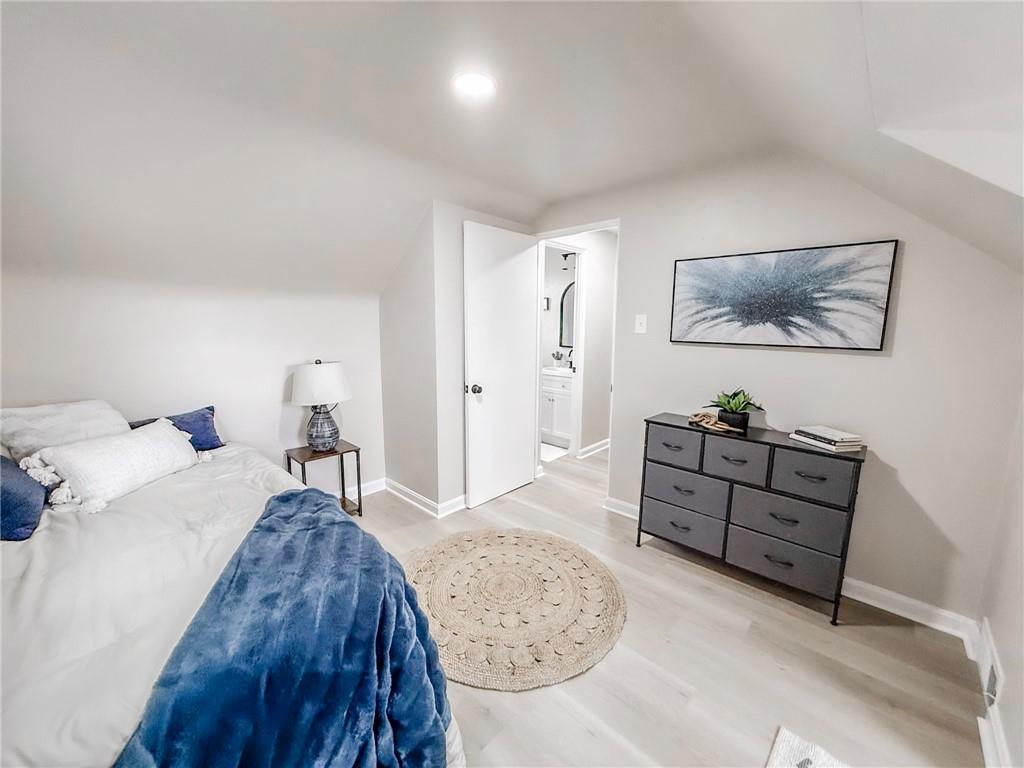 1529 Bower Hill Road Pittsburgh, PA 15243 - Photo 20 of 28 a bed room with a bed and a painting on the wall