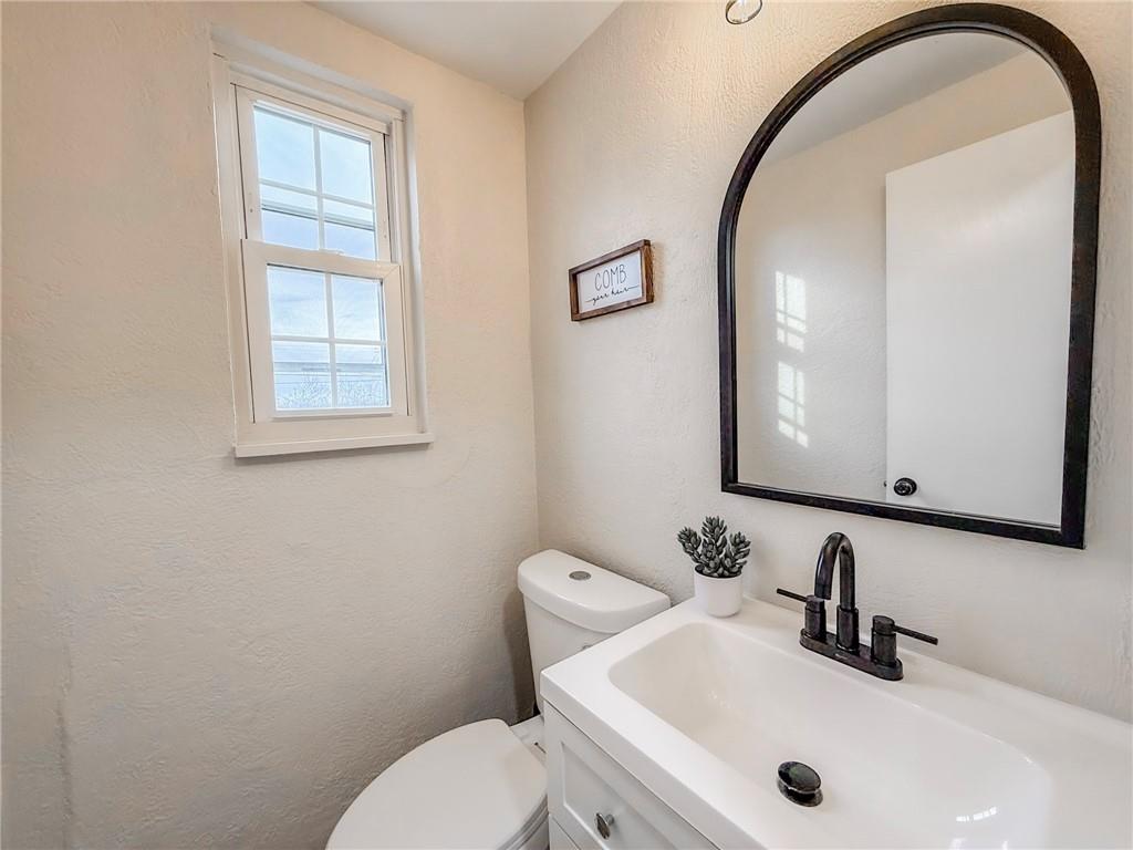 1529 Bower Hill Road Pittsburgh, PA 15243 - Photo 23 of 28 a bathroom with a sink a toilet and a mirror