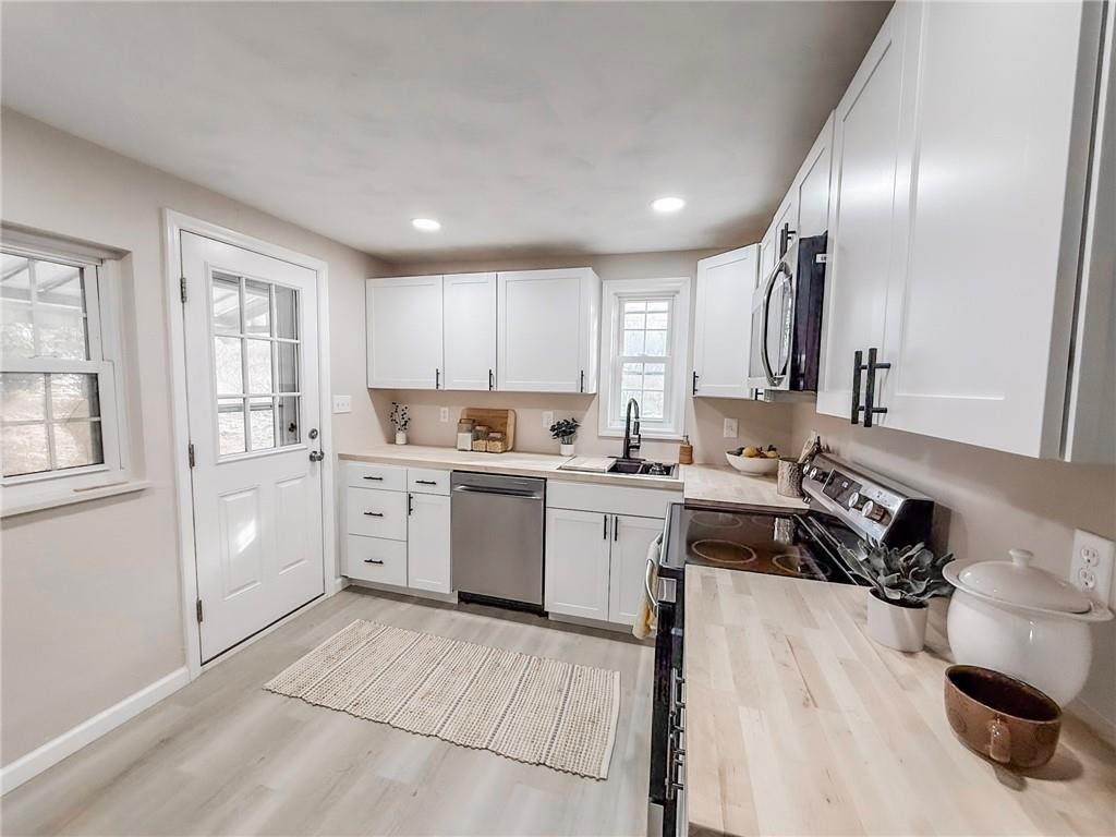 1529 Bower Hill Road Pittsburgh, PA 15243 - Photo 7 of 28 a kitchen with a sink window and cabinets