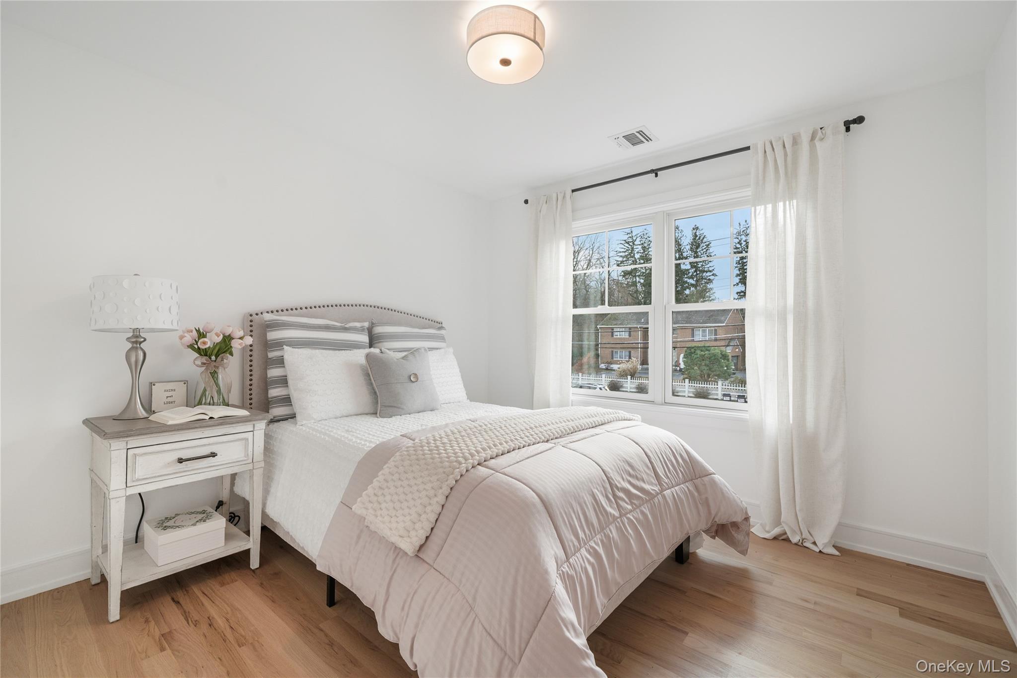 2040 Crompond Road, Unit 19 Yorktown Heights, NY 10598 - Photo 13 of 18 a bedroom with a bed and a window