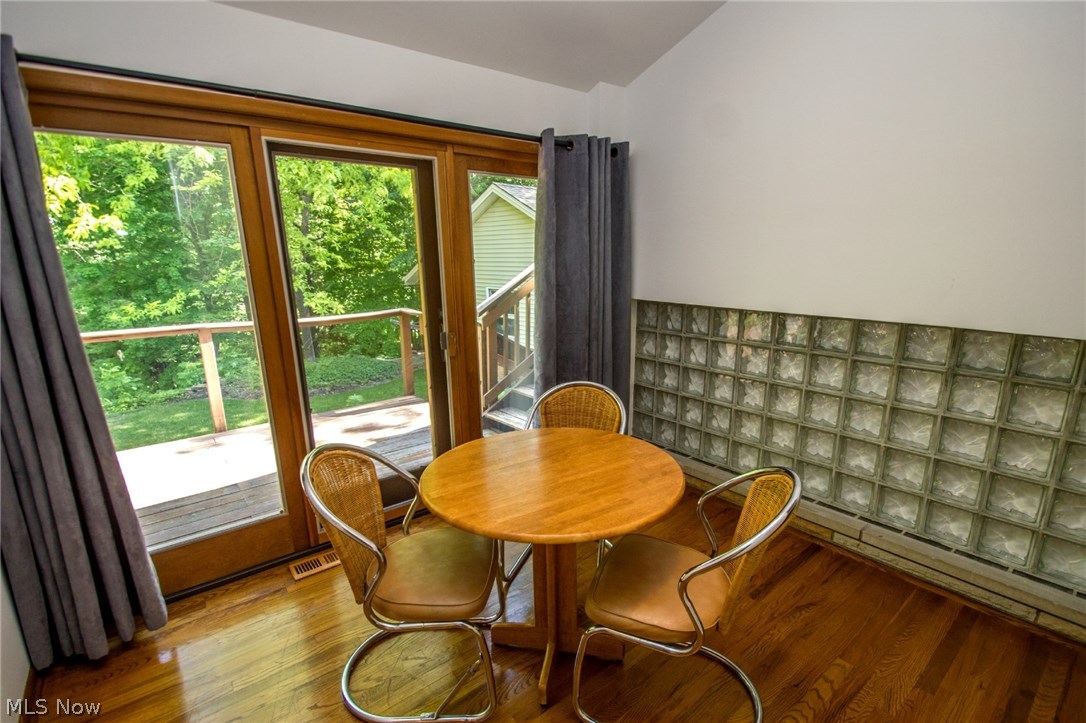 8107 Stone Road Independence, OH 44131 - Photo 6 of 29 Dining room with hardwood floor and deck access