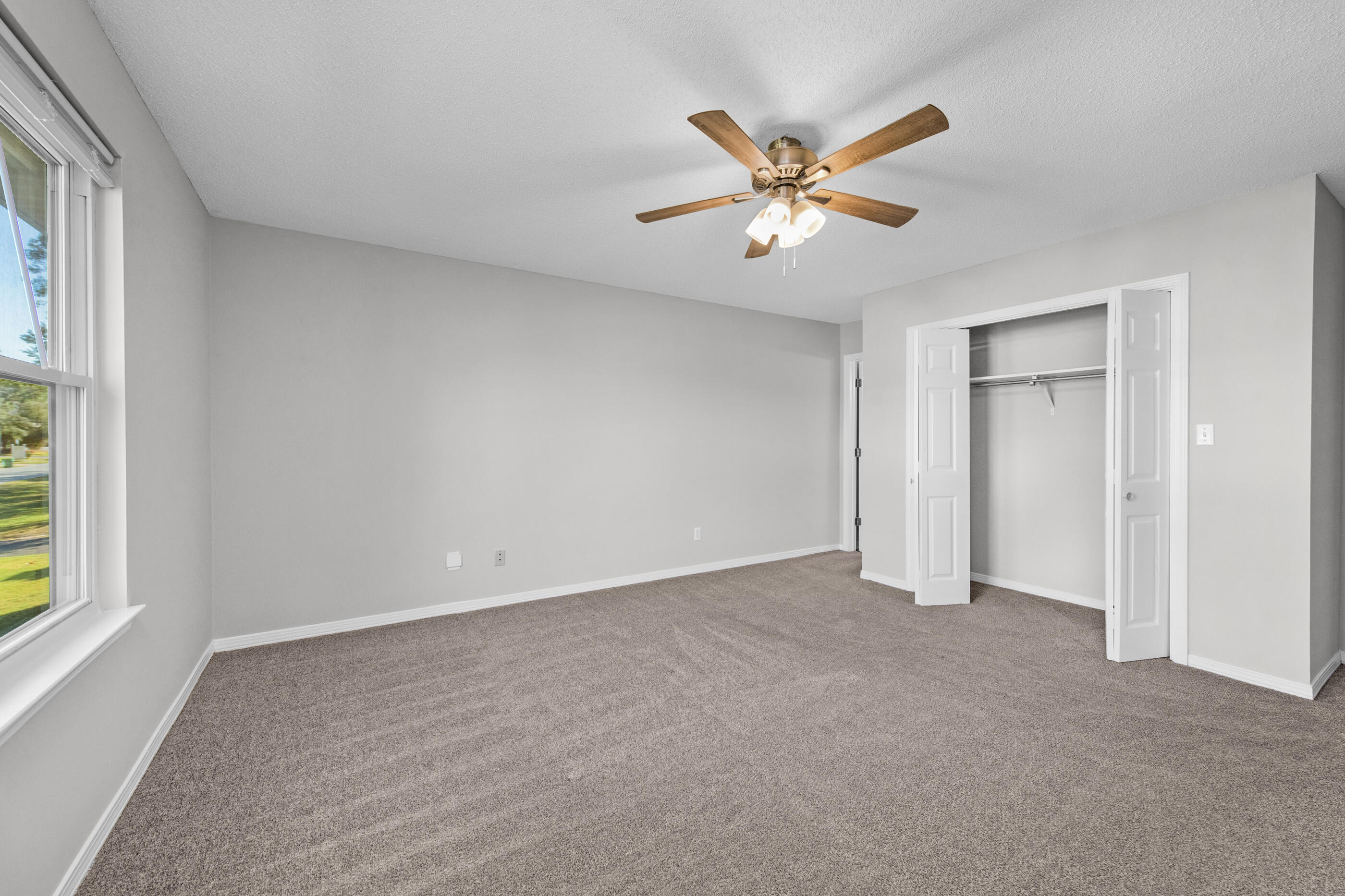 106 4th Avenue Shalimar, FL 32579 - Photo 14 of 29 a view of an empty room with a window