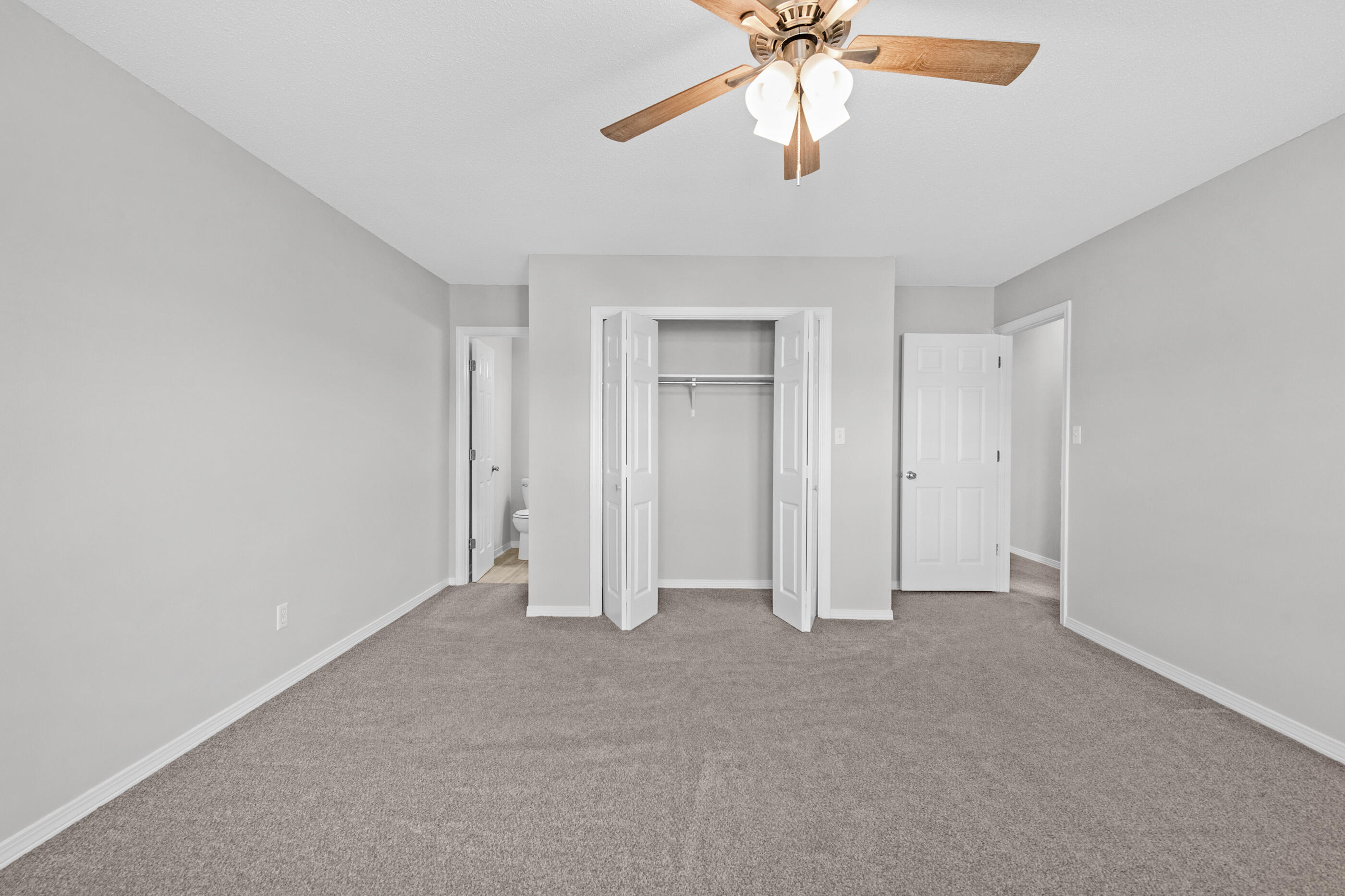 106 4th Avenue Shalimar, FL 32579 - Photo 15 of 29 an empty room with chandelier fan