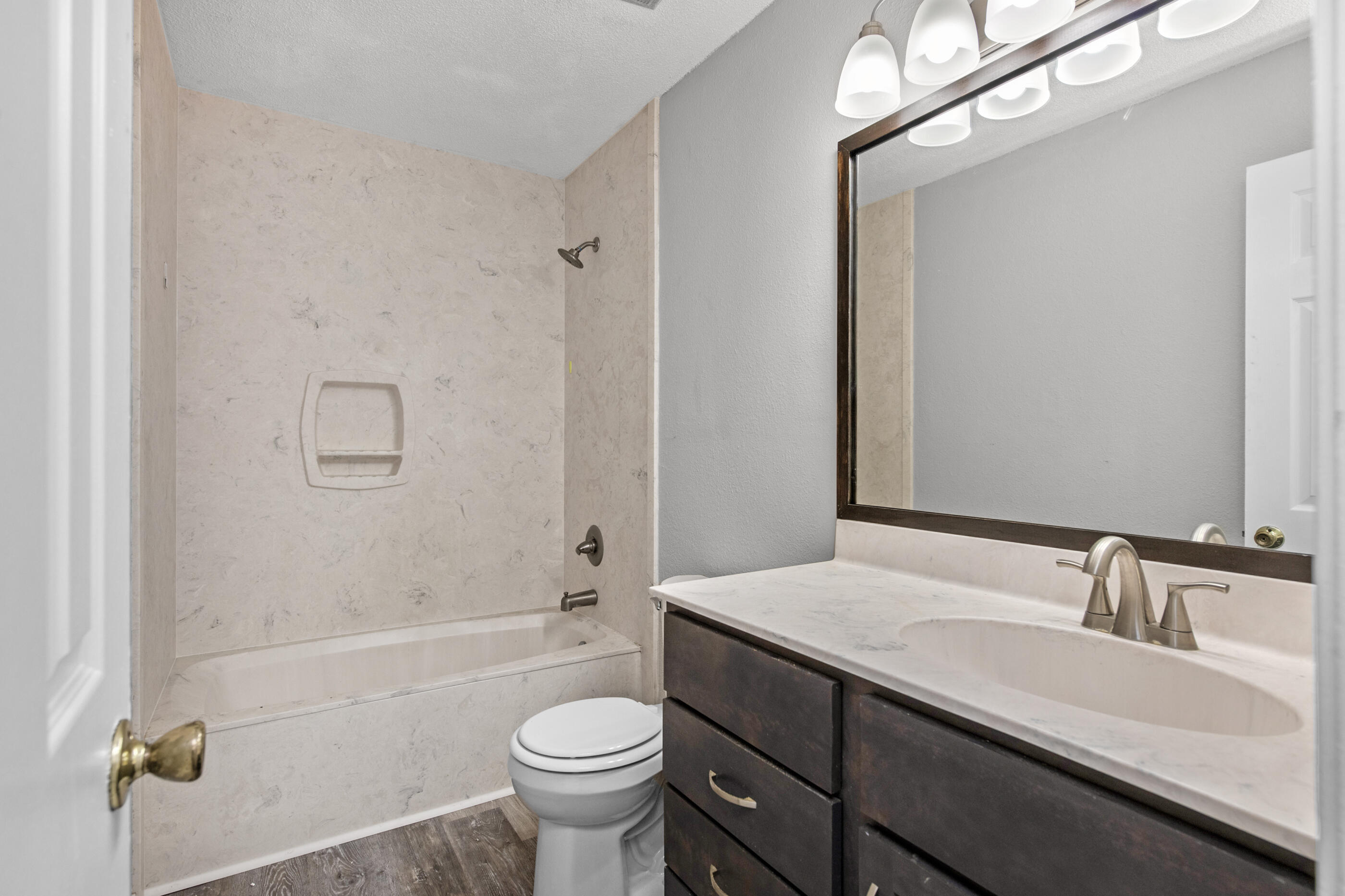 106 4th Avenue Shalimar, FL 32579 - Photo 19 of 29 a bathroom with a sink a toilet and shower