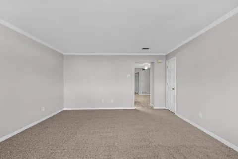 a bathroom with a granite countertop sink a toilet a mirror and shower