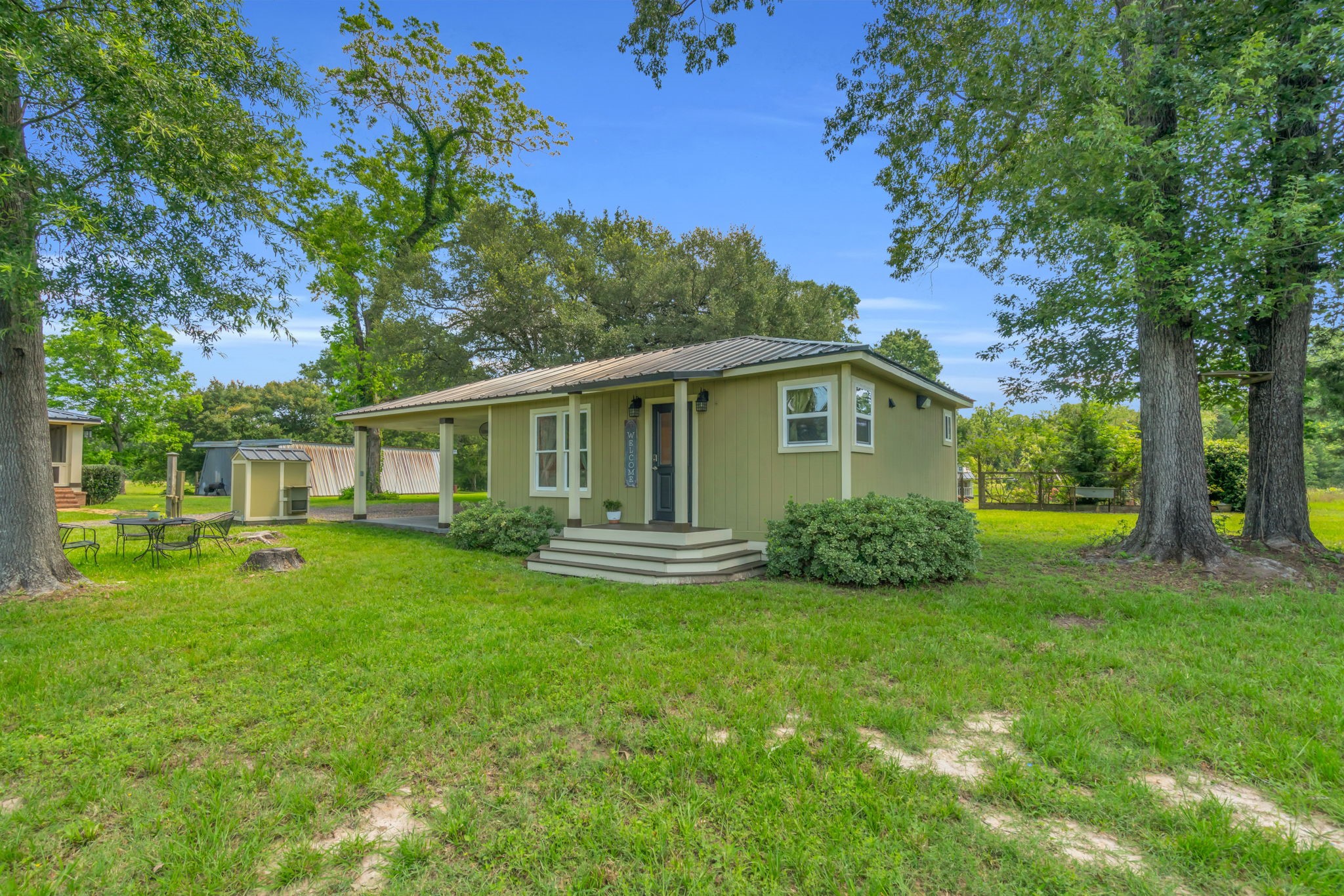 17821 Brown Road Conroe, TX 77306 - Photo 40 of 50 a view of a house with a yard and tree s