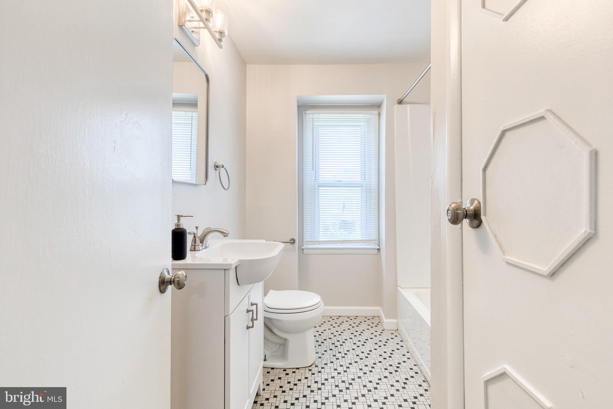 5649 Utrecht Road Baltimore, MD 21206 - Photo 30 of 42 a bathroom with a sink a toilet and shower