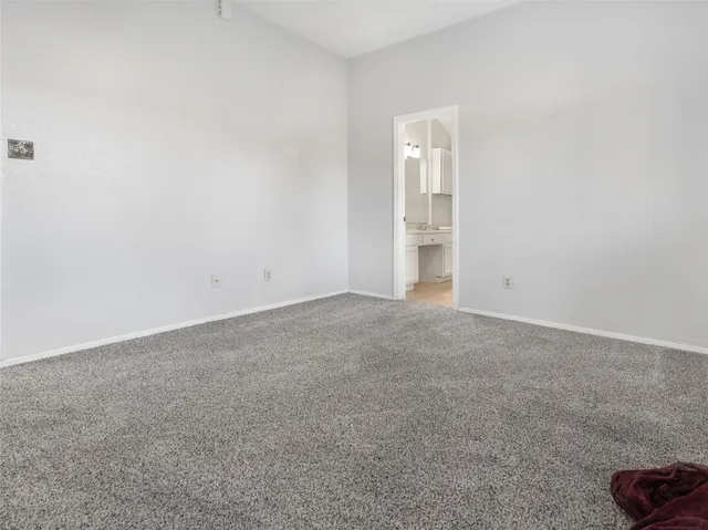 a view of an empty room and closet area