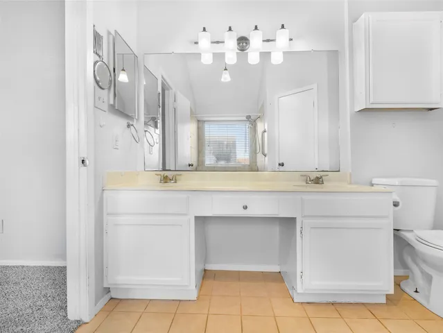 a bathroom with a sink vanity and mirror