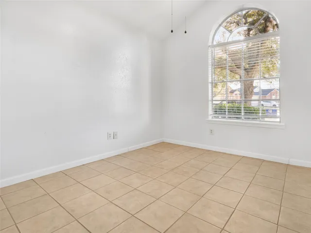 an empty room with a empty space and a window